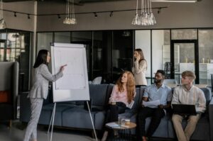 Colleagues brainstorm during a business meeting in a stylish office space.
